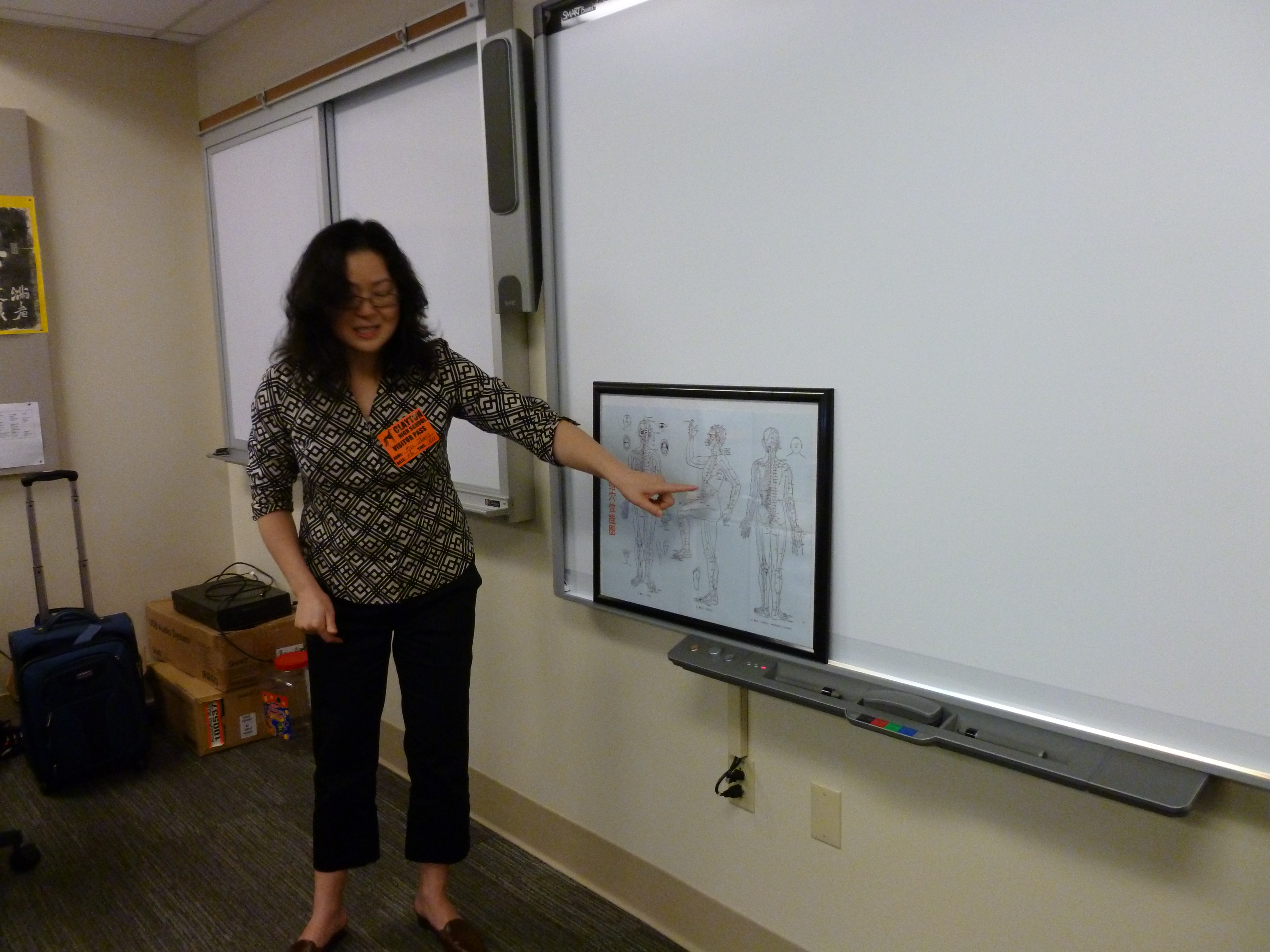 Presenting acupuncture meridian chart at Clayton High School